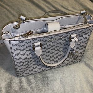 Space gray Michael Kors purse.